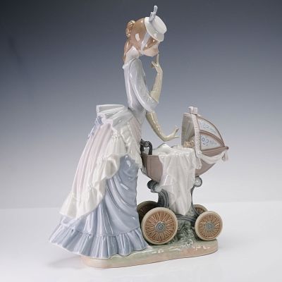Lladro Porcelain Sculpture, Baby's Outing 01004938. Baby's Outing depicts a Victorian-era mother 