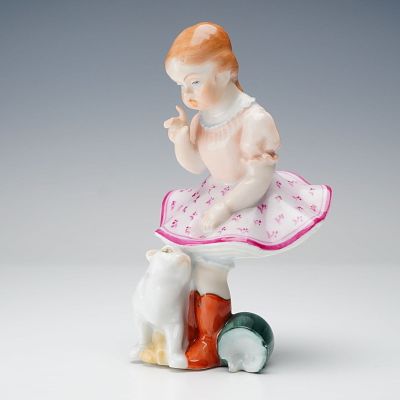 Herend Porcelain Figurine, Girl with a Cat and Spilt Milk. A porcelain figurine showing a girl 