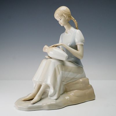 Porceval Spain Porcelain Figurine, Girl with Vase. The figure is crafted in soft pastel tones 