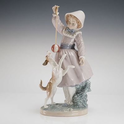 Lladro Porcelain Figurine Teasing the Dog Model 5078. A Lladro Porcelain Figurine, titled 