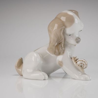 Lladro Glazed Porcelain Dog and Snail Figurine. A single glazed porcelain Dog Figurine 