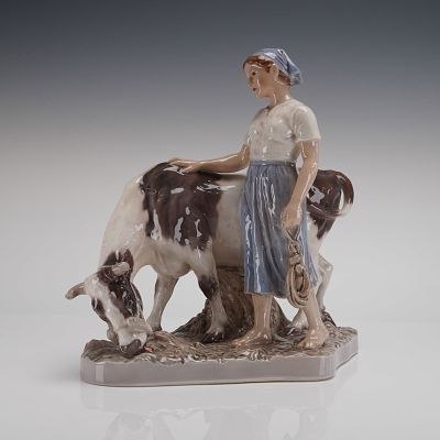 Dahl Jensen Porcelain Figural Group Milkmaid with Cow, Model 1792. A single glazed porcelain 