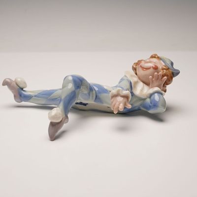 Lladro Porcelain Figurine, Neglected 1001503. This glazed porcelain figurine depicts a reclining 