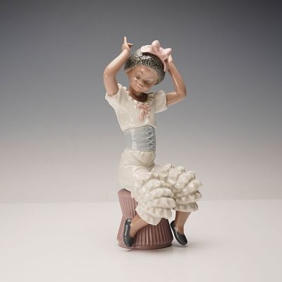 Lladro Porcelain Figurine, Rhumba 1005160. This glazed porcelain figurine depicts a young girl 