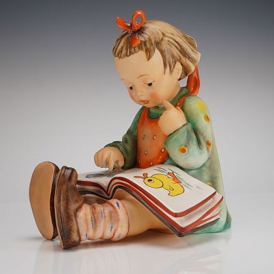 Goebel M.J. Hummel Figurine Bookworm, Hum 3/II. A single glazed ceramic figurine by Goebel 