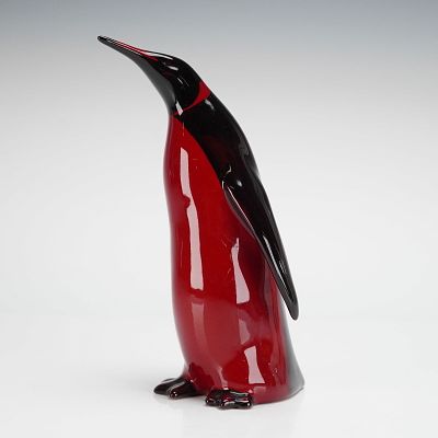 Royal Doulton Flambe Emperor Penguin Figurine. The piece features the characteristic flambe 