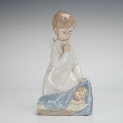 Lladro Figurine Angel with Child 01004635. The figurine depicts a kneeling angel with small 