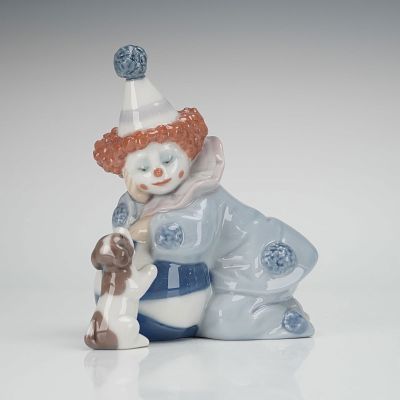 Lladro Figurine Pierrot with Puppy & Ball 01005278. The piece depicts a seated clown figure 