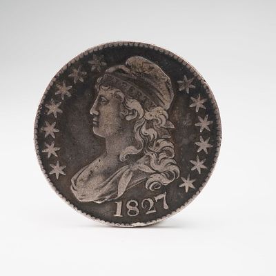 1827-(P) Capped Bust Half Silver Dollar. Struck at the Philadelphia Mint, this early American 