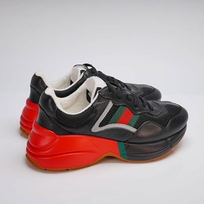 Pair of Black Gucci Rhyton Sneakers. A pair of Black Gucci Rhyton Sneakers, constructed with a 
