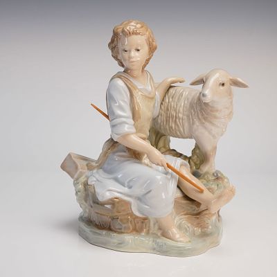Zaphir Glazed Porcelain Shepherd Boy Nativity Figurine. A glazed porcelain figural group 