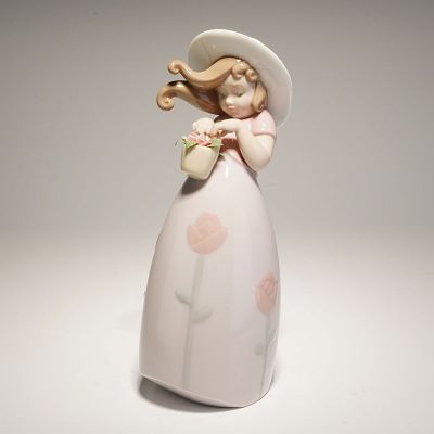 Lladro Porcelain Figurine Little Rose 01008042. The figure depicts a young girl with windblown 
