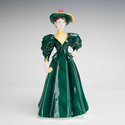 Coalport Bone China Figurine, Candida. A Coalport figurine depicting a woman in late Victorian 