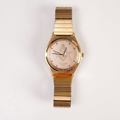 Bulova Accutron Quartz Masonic Wristwatch. Wristwatch featuring a gold-tone case and matching 