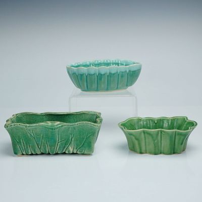 A Trio of Vintage American Art Pottery Planters, Including McCoy. This lot comprises three 