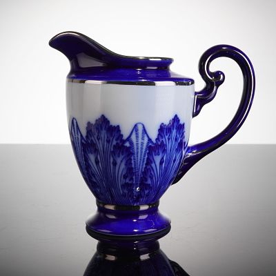 Bombay Company Blue and White Porcelain Creamer. The creamer has an hourglass-like body with a 