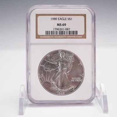 1989 Silver Eagle Type 1 Dollar NGC Graded MS-69. Struck in one troy ounce of .999 fine silver 