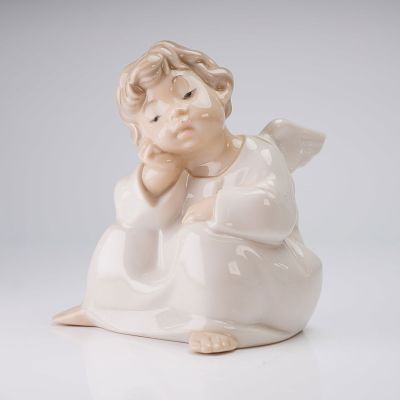 Lladro Porcelain Figurine, Angel Thinking 1004539. A glazed porcelain figurine by Lladro, titled 