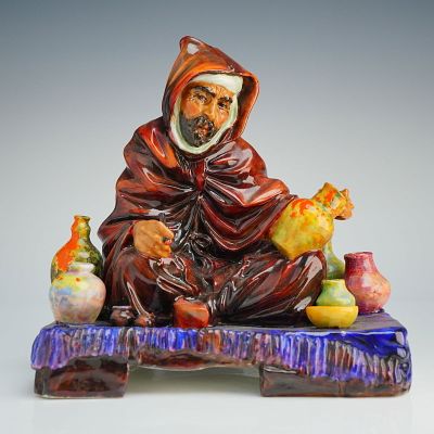 Royal Doulton Figurine The Potter HN1493. The piece depicts a seated man in an Orientalist style 