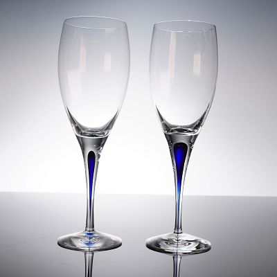 A Pair of Orrefors Intermezzo Blue Crystal Champagne Flutes. A pair of contemporary champagne 