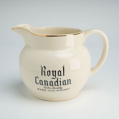 Wade Porcelain Pitcher for Royal Canadian Whisky. The advertising vessel features a globular 