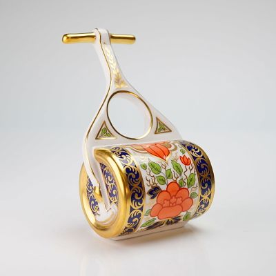 Royal Crown Derby Figurine, Miniature Garden Roller. This piece is decorated in a traditional 