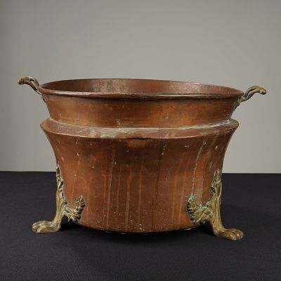 Copper and Brass Paw Foot Pot with Handles. A copper pot with brass handles and three feet 