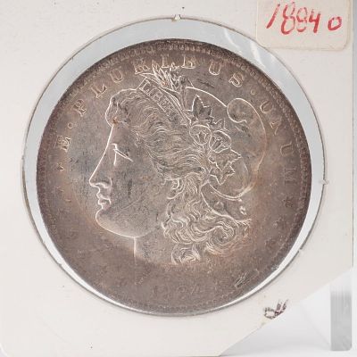 1884-O Morgan Silver Dollar. An 1894-O Morgan Silver Dollar, minted in New Orleans and bearing 