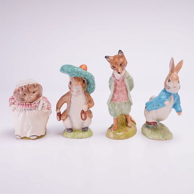 Collection of Four Beswick Beatrix Potter Figurines. A collection of four hand-painted ceramic 