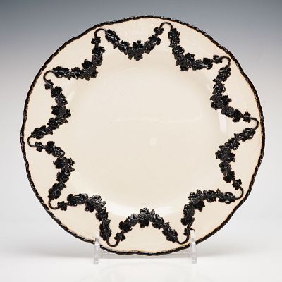 Wedgwood Creamware Plate with Black Basalt Bas-Relief Decoration. A Wedgwood creamware plate 