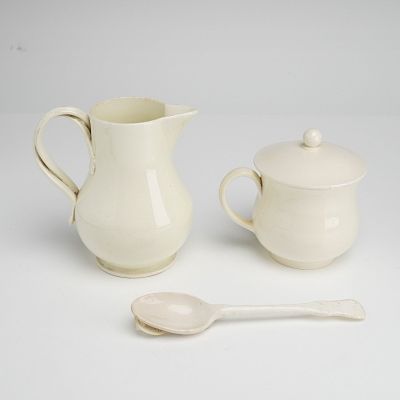 Three Wedgwood Creamware Pots De Creme with Lid, Creamer, and Spoon. A three-piece set of 