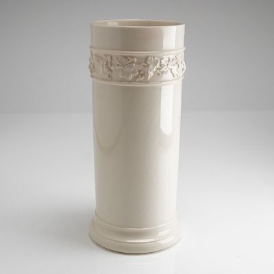 Wedgwood Embossed Queensware Grapevine Cylindrical Vase. A single cylindrical ceramic vessel 