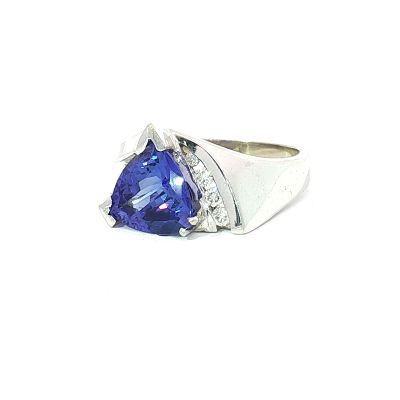 14K White Gold Trillion Cut Tanzanite and 0.15ctw Diamond Ring. This ring is crafted from 14k 
