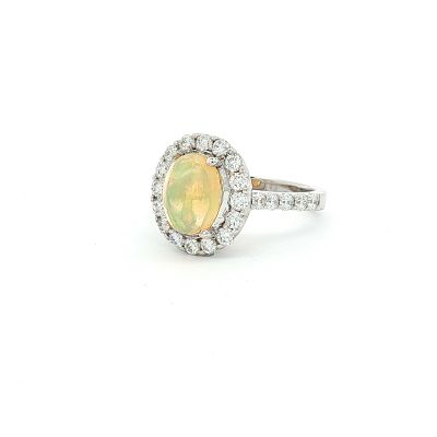 14K White Gold, 1.58ct Opal and 0.97ctw Diamond Ring. This estate ring is constructed of 14K 