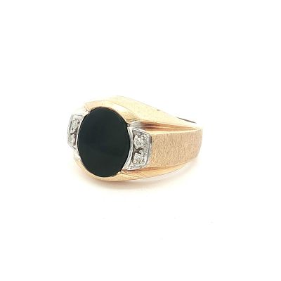 14K Yellow Gold, Diamond and Onyx Ring. Crafted from 14K yellow gold, this ring features a 