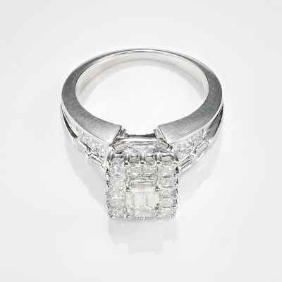 18K White Gold 1.00ctw Diamond Ring. This refined ring features an emerald cut diamond at the 