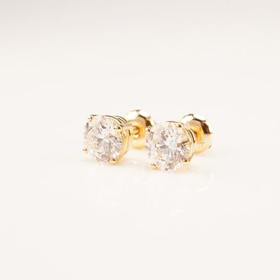 14K Gold 1.84ctw Diamond Stud Earrings. This pair of yellow gold screw-back stud earrings 