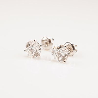 14K White Gold 2.08ctw Diamond Stud Earrings. A pair of white gold screw-back stud earrings set 