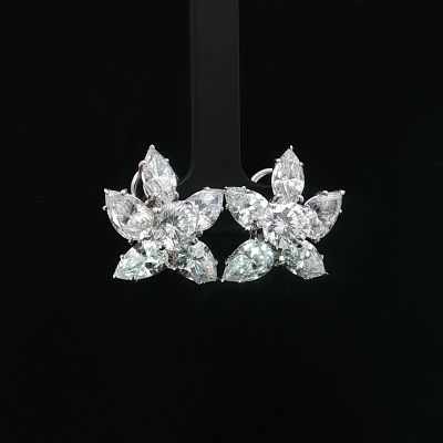 14K White Gold Clear Stone Clip Earrings. A pair of white gold omega-back earrings featuring 
