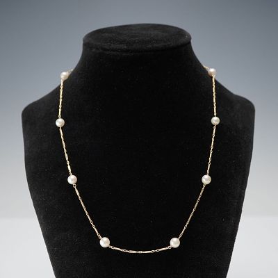 14K Gold Cultured Pearl Station Necklace. Necklace featuring evenly spaced cultured pearls set 