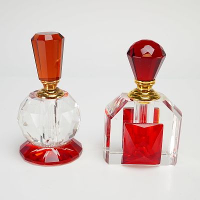 A Pair of Cut Crystal Perfume Bottles with Red Glass Accents. A set of 2 small crystal perfume 