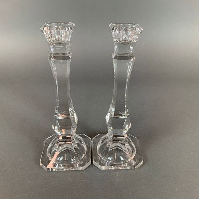 A Pair of Clear Crystal Candle Holders. This pair of crystal candle holders is designed with a 
