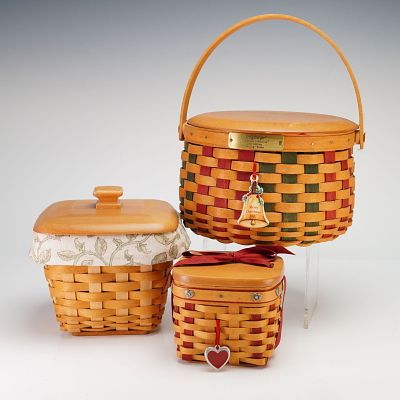 Three Longaberger Maple Wood Hand Woven Baskets with Lids. This lot features three authentic 