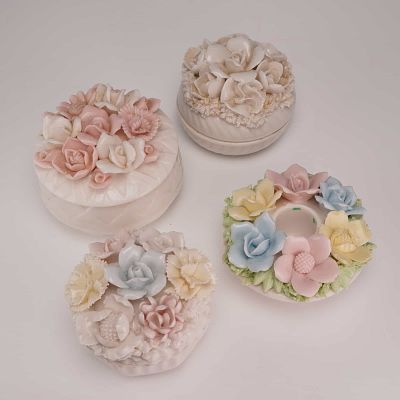 4pc Porcelain Floral Trinket Boxes and Candlestick Holder. This glazed porcelain group includes 
