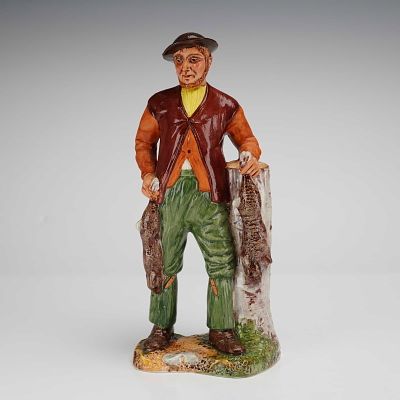 Coalport Bone China Figurine The Poacher. The figure depicts a man in rustic period clothing 