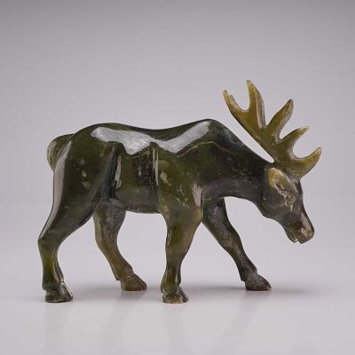 Inuit Hand Carved Jade Moose Figurine. A hand-carved inuit jade figurine depicting a moose in a 