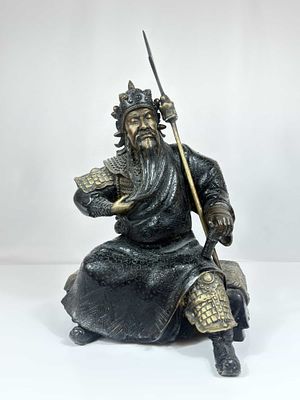 Chinese Cast Bronze Figure of Genghis Khan Seated in Armor. This cast bronze figural sculpture 