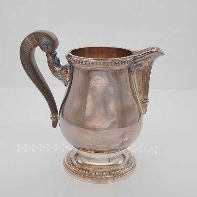 Christofle Malmaison Silver Plated Cream Pitcher with Wood Handle. A silver-plated cream pitcher 