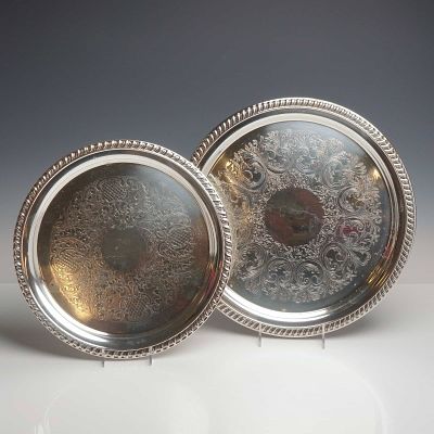 Two Silver-Plated Circular Trays with Chased Decoration. A pair of circular silver-plated trays 