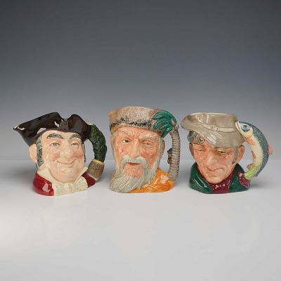 Royal Doulton Three Character Jugs. This set of three Royal Doulton character jugs is crafted 